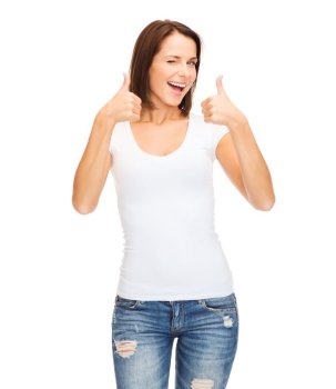 happy people concept - woman in blank white t-shirt showing thumbs up and winking