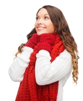 winter, people, happiness concept - happy woman in sweater, scarf and mittens