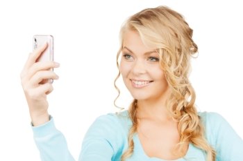 technology concept - smiling woman taking photo with smartphone
