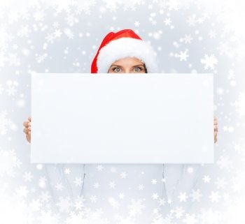 christmas, x-mas, people, winter, advertisement and sale concept - surprised woman in santa helper hat with blank white board