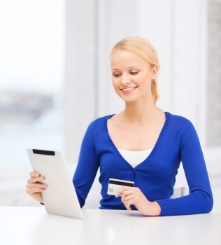 online shopping and technology concept - smiling young woman with tablet pc computer and credit card