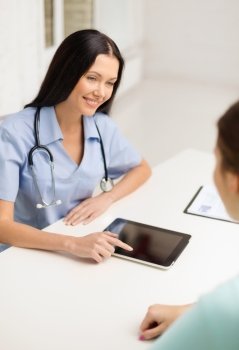 healthcare, medicine and technology - female doctor or nurse with tablet pc computer having appointment with patient