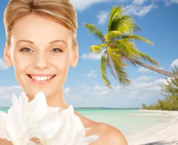 beauty, people, travel and health concept - beautiful young woman with bare shoulders over tropical beach background