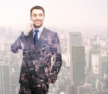 business, people, development and technology concept - smiling young businessman over transparent city background