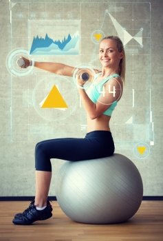fitness, sport, training, future technology and lifestyle concept - smiling woman with dumbbells and exercise ball in gym and graph projection