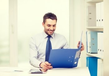 business, office and technology concept - smiling businessman with folder and tablet pc computer at office