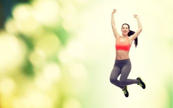 fitness and diet concept - beautiful sporty teenage girl jumping in sportswear