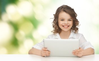 people, technology and children concept - happy smiling girl with tablet pc computer over green background
