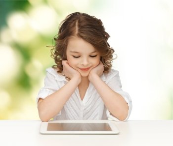 people, technology, education and children concept - happy smiling girl with tablet pc computer over green background