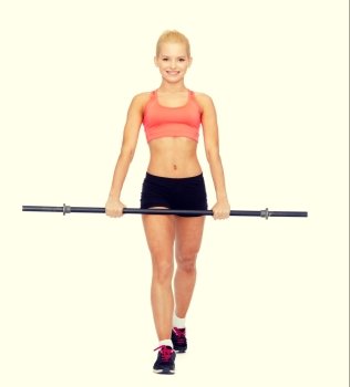 fitness, sport and exercise concept - smiling sporty woman with barbell stepping forward