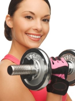 picture of beautiful sporty woman with dumbbells