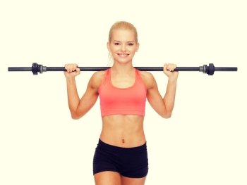 fitness, sport and exercise concept - smiling sporty woman exercising with barbell