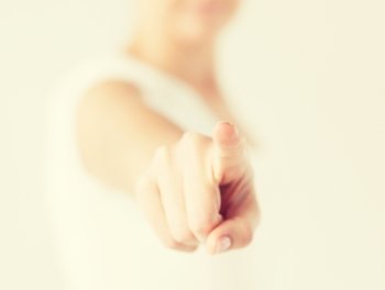 close up of woman pointing her finger at you