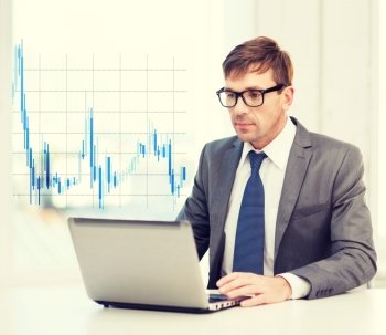 technology, money, business and office concept - handsome businessman in black eyeglasses with laptop computer and forex chart