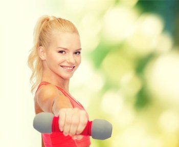 fitness, sport and diet concept - smiling beautiful sporty woman with dumbbell