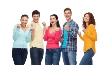 friendship, youth, gesture and people concept - group of smiling teenagers showing triumph gesture