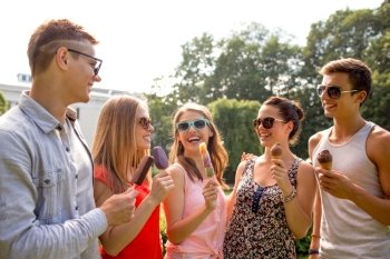 friendship, leisure, sweets, summer and people concept - group of smiling friends with ice cream outdoors