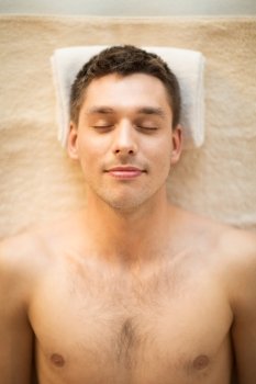 close up of man face in spa salon. man in spa