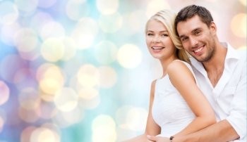 summer holidays, dating, love, romance and people concept - happy couple hugging fun over blue holidays lights background