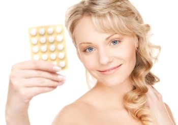 picture of young beautiful woman with pills .