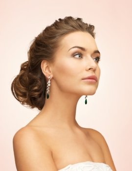 beautiful woman in white dress and diamond earrings. woman with diamond earrings