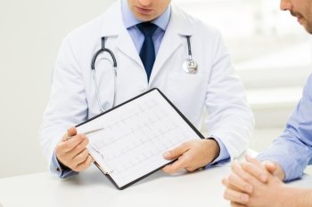 medicine, health care, people and cardiology concept - close up of f male doctor and patient hands with cardiogram on clipboard