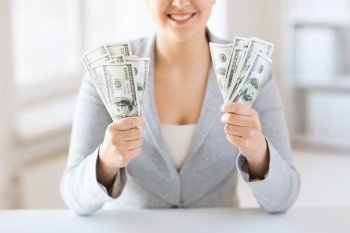 business, finance, saving, banking and people concept - close up of woman hands holding us dollar money