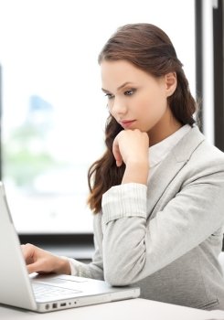 picture of serious businesswoman using her laptop computer