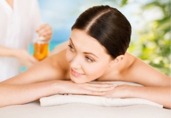 picture of woman in spa salon getting oil treatment. woman in spa