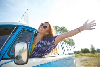 summer holidays, road trip, vacation, travel and people concept - smiling young hippie woman driving minivan car and waving hand
