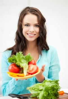 beautiful woman in the kitchen with vegetables
