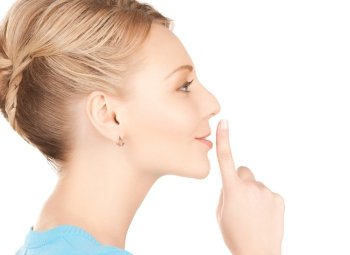 picture of mysterious woman with finger on her lips