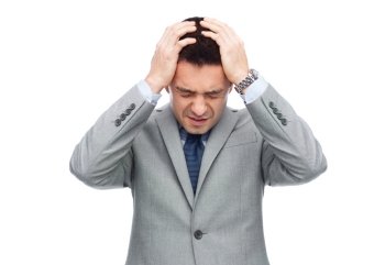 business, people, crisis and fail concept - businessman in suit having head ache