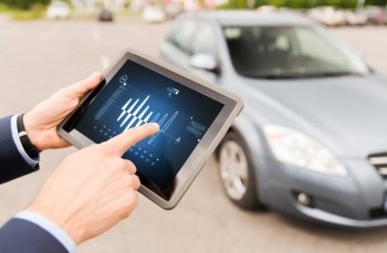 vehicle, technology, diagnostics and people concept - close up of male hands with diagram on tablet pc computer screen and car outdoors