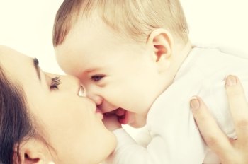 picture of happy mother with baby over white. happy mother kissing baby boy