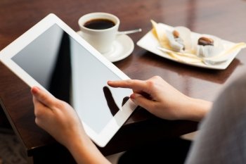 business, people, technology and lifestyle concept - close up of woman with tablet pc computer, coffee and dessert