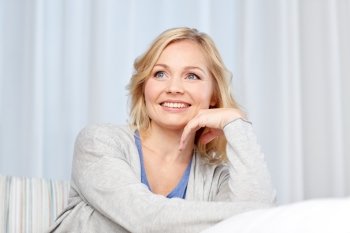 people and leisure concept - happy middle aged woman at home. happy middle aged woman at home
