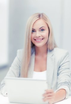 picture of smiling businesswoman using her laptop computer. businesswoman with laptop