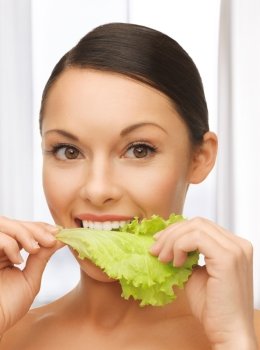 bright picture of beautiful woman with lettuce