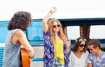 summer holidays, road trip, vacation, travel and people concept - happy young hippie friends having fun and dancing over minivan car