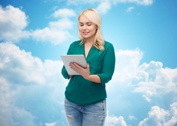 technology, internet and people concept concept - smiling woman with tablet pc computer over blue sky and clouds background