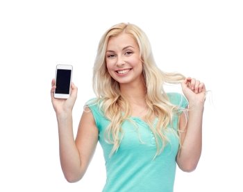 emotions, expressions, technology and people concept - smiling young woman or teenage girl showing blank smartphone screen