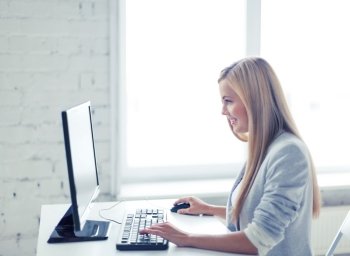 picture of smiling businesswoman with computer in office. businesswoman with computer in office