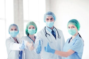 young team or group of doctors in operating room. group of doctors in operating room
