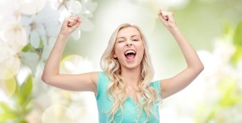 emotions, expressions, success and people concept - happy young woman or teenage girl celebrating victory over natural spring background