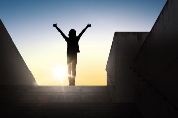 gesture, success, achievement and people concept - happy young woman or teenage girl silhouette showing thumbs up with both hands standing on stairs over sun light background