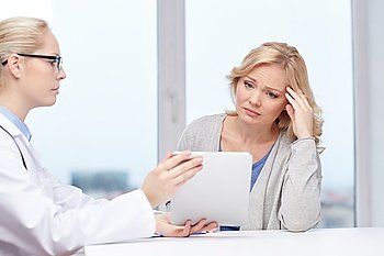 medicine, health care and people concept - doctor with tablet pc computer and unhappy ill woman meeting at hospital