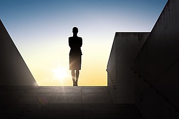 business, success, achievement and people concept - silhouette of woman standing on stairs over sun light background