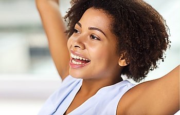 people, race, ethnicity and success concept - face of happy african american young woman celebrating victory