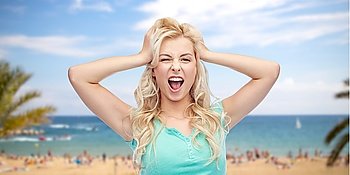 emotions, expressions, summer holidays, travel and people concept - smiling young woman or teenage girl holding to her head or touching hair over tropical beach with palm trees and sea background